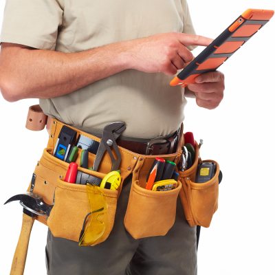 Handyman with a tool belt. Isolated on white background.